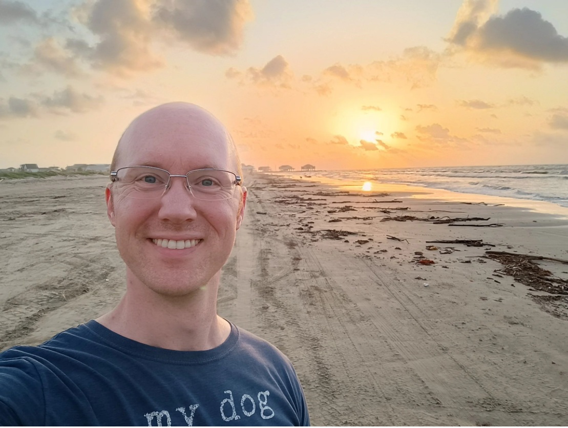 Jason taking a sunrise selfie on the beach